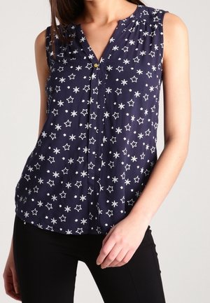 Blusa senza maniche blu navy con scollatura a V, chiusura a bottoni e motivo stellato bianco. Tessuto leggero e traspirante con una vestibilità comoda.