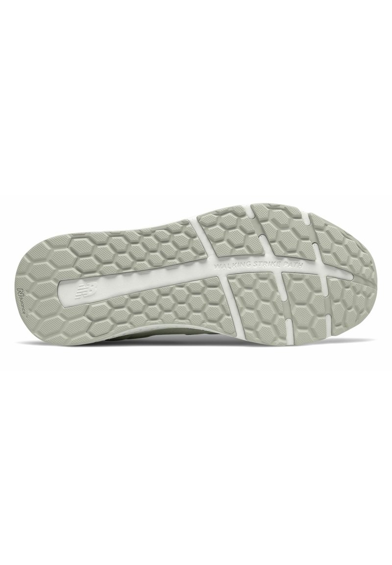 Suela de zapato en goma gris claro con patrón texturizado hexagonal, cuenta con acentos blancos y la inscripción "CAMINO DE PASADA AL CAMINAR".