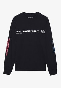 Black long-sleeve t-shirt featuring white and pink text, with graphics on sleeves. Includes "LATE NIGHT" and "CONTRADICTORY FEATURES" prints.