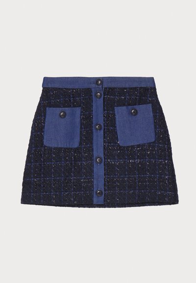Tweed mini krilo z mrežastim vzorcem, temno modre barve, z dvema sprednjima žepoma in zapiranjem na gumb. Teksturovani material z denimu podobnimi detajli.