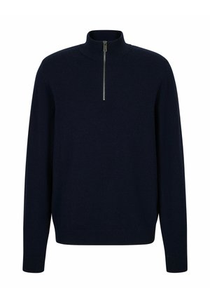 Granatowy pulower z wysokim kołnierzem i krótkim zamkiem. Wykonany z miękkiej tkaniny z prążkowanymi mankietami i ściągaczem. Prosty i klasyczny design.