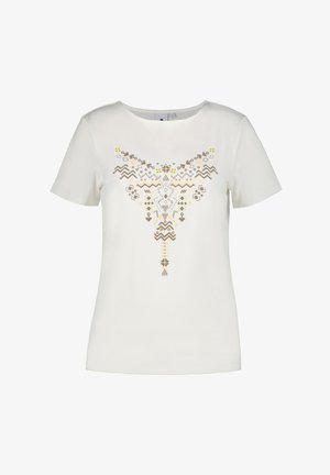 Witte t-shirt met korte mouwen, voorzien van een geometrische meerkleurenprint in beige, geel en lichtroze. Zacht materiaal met een relaxed fit.