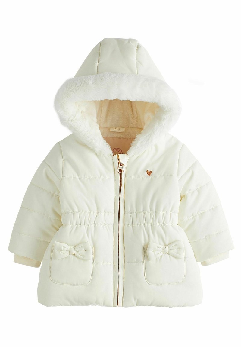 Veste d'hiver bébé couleur crème avec capuche doublée de fourrure douce, fermeture éclair devant, deux poches ornées de nœuds et un subtil détail de cœur brodé.