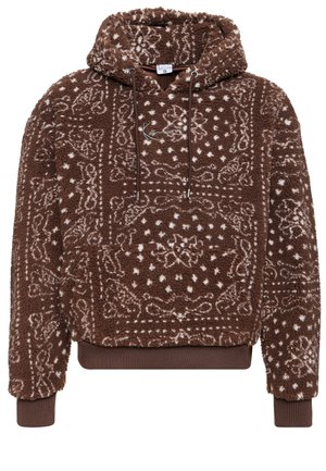 Sweatshirt à capuche marron en matière pelucheuse, avec un motif blanc et une poche frontale. Comprend des cordons de serrage et des poignets et un ourlet côtelés.