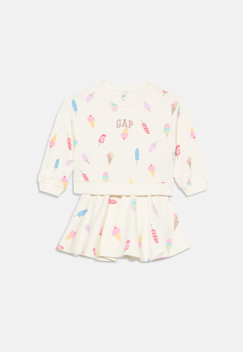 Φόρεμα για νήπιο σε κρεμ απόχρωση με μακριά μανίκια, πολύχρωμες εκτυπώσεις με παγωτά και λουκούμια και το κείμενο "GAP" στο στήθος.
