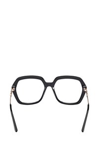 Zwarte acetate bril met een zeskantig montuur, voorzien van goudkleurige metalen details en slanke zwarte pootjes. Gehele montuur met een gestructureerde afwerking.