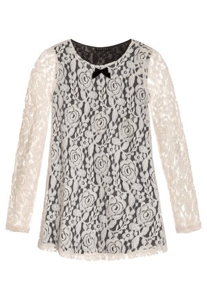 Robe noire à manches longues avec overlay en dentelle florale blanche et petit nœud noir au col rond.