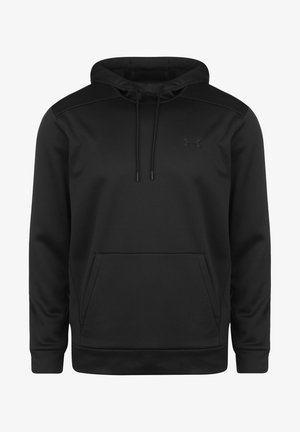 Melna kapucīne, kas izgatavota no mīkstas auduma. Tai ir liela priekšējā kabata, auklas un diskrēta zīmola emblēma uz krūšu daļas. Gluda tekstūra.