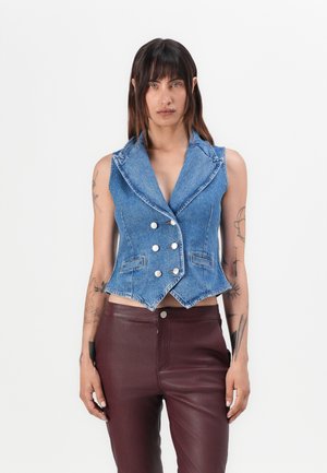 Light blue denim vest with a pointed collar, double-breasted silver buttons, and two front pockets. Fitted shape, no sleeves.