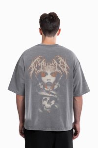 Gray oversized t-shirt featuring a large graphic design on the back, showcasing a face, skulls, and snake elements in contrasting colors.