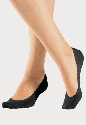 Schwarze, unsichtbare Socken mit gewelltem Rand, aus einem glatten, dehnbaren Stoff gefertigt. Verfügt über ein niedrigen Schnitt für diskreten Tragekomfort.