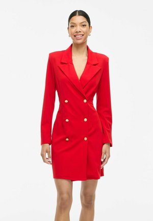 Red blazer dress with a double-breasted design, prominent lapels, and gold buttons. Long sleeves and tailored fit enhance its structured look.