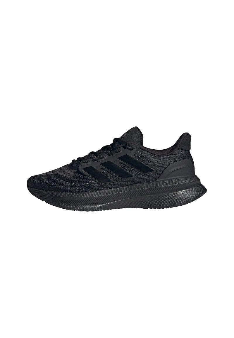 Baskets noires de sport avec une tige en tricot, présentant une finition texturée, une semelle rembourrée et un design à trois bandes sur les côtés.