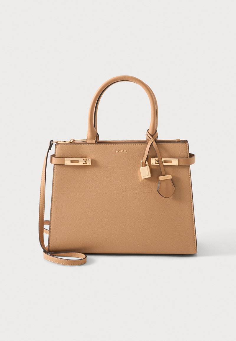 Sac à main en cuir couleur tan avec doubles poignées, bandoulière amovible, accents dorés sur la serrure et logo de la marque au centre avant.
