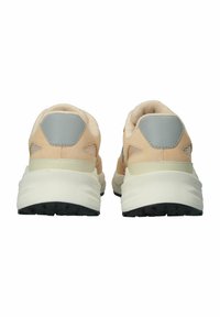 Light beige sneakers with grey accents, featuring a textured upper and cushioned sole, designed for comfort and stability.
