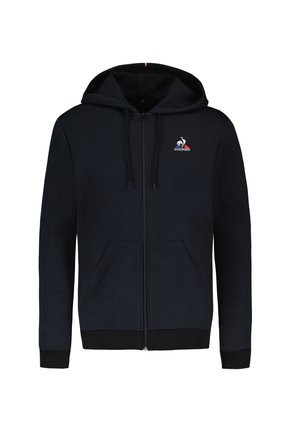 Sweat à zip marine avec deux poches avant, une capuche avec cordon de serrage et un logo sur la poitrine gauche. Les poignets et le bas côtelés ajoutent de la texture.