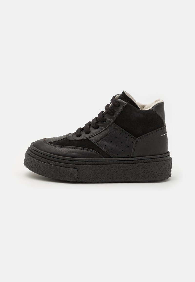 Black high-top sneaker featuring leather and suede materials, textured chunky sole, round toe, lace-up closure, and perforated accents.