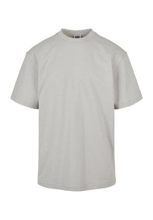 Camiseta de algodón de color gris claro, de manga corta. Cuenta con un cuello redondo y un corte relajado, sin patrones ni adornos adicionales.