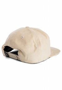 Beige corduroy baseball cap with a soft texture, curved brim, adjustable plastic strap at the back, and embroidered ventilation holes.