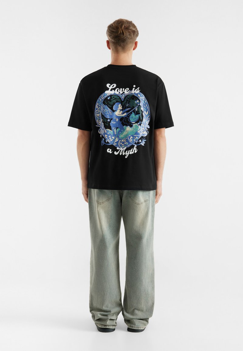 Black cotton t-shirt featuring a colorful graphic on the back with a heart design, angel, and text reading "Love is a Myth." Relaxed fit.