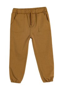 Brune, strækbare stofbukser med elastisk talje, snøre og to forreste lommer. Taperede ben med elastiske manchetter ved anklerne.