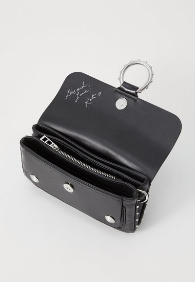 Black leather wallet with a silver ring and snap closure. Features a zipper pocket, card slots, and a handwritten note inside.
