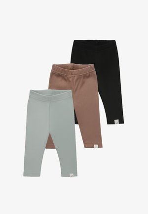 Drei Baby-Leggings aus geripptem Strick in Schwarz, Braun und Hellgrau, jeweils mit einem kleinen weißen Etikett nahe dem Knöchel vor weißem Hintergrund.