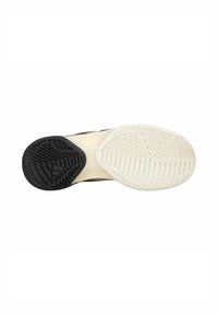 Schuhsohlendesign mit einem schwarzen Gummifersenbereich, einer cremefarbenen Zwischensohle und strukturierten Grip-Mustern für besseren Halt.