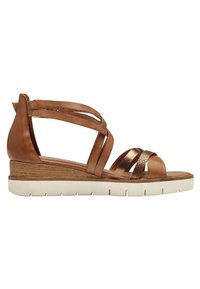 Brown leather wedge sandal with crisscross straps, textured accents, and a white rubber sole, featuring a medium height heel.