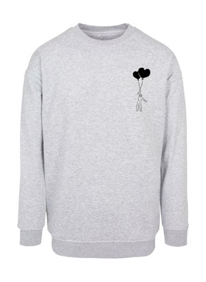 Grijze sweatshirt gemaakt van een katoenmix, met een zwarte bedrukte afbeelding van een persoon die twee hartvormige ballonnen vasthoudt op de linkerborst.