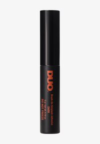 Svart tub av DUO Brush-On Dark Adhesive, med en orange logotyp, en penselapplikator och klara etiketter som anger innehåll och användning.