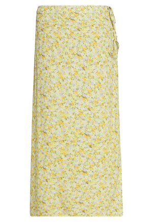 Jupe portefeuille fleurie en jaune pâle, vert et blanc avec de petites fleurs, nouée sur le côté, longueur midi avec coupe droite.