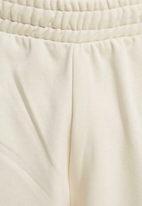 CONSTRUCTION JOGGING - Teplákové kalhoty - sand green