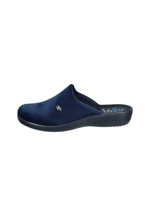 Navy blue velvet clogs with a rounded toe, soft texture, and low-profile black sole. Features a subtle metallic logo on the upper.