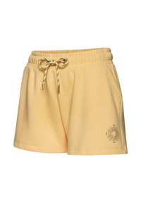 Yellow cotton shorts with an elastic waistband and drawstring. Features side pockets and a sun graphic near the hem. Soft texture.