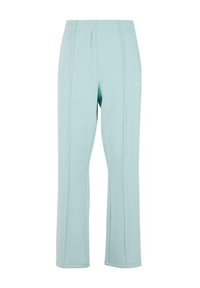 Hellblaue, elastische Hosen mit einem weichen Stoff, gerade Beine, seitliche Nähte und minimaler Branding auf der Vorderseite.