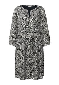 Schwarz-weißes Kleid mit Zebra-Print, 3/4-Ärmeln, Rundhalsausschnitt mit Schlitzöffnung und lockerer Passform.