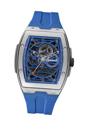 Montre automatique avec un boîtier en acier inoxydable, un bracelet en caoutchouc bleu et un cadran ajouré mettant en valeur des engrenages complexes et des accents bleus.
