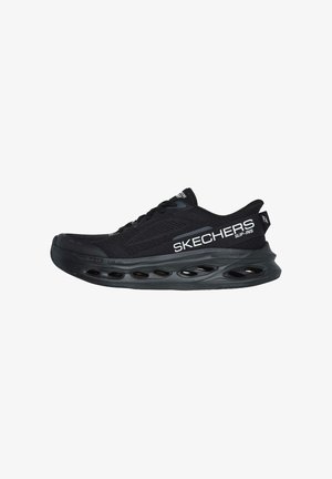 Black athletic shoe with mesh upper, lace-up design, and prominent white "SKECHERS" logo. Features a cushioned sole with oval cutouts.