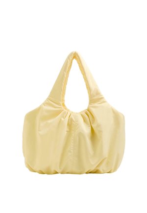 Geantă oversize de culoare galben moale, cu mânere late și căptușite și detalii cu țesătură adunată pe laterale și pe fund.