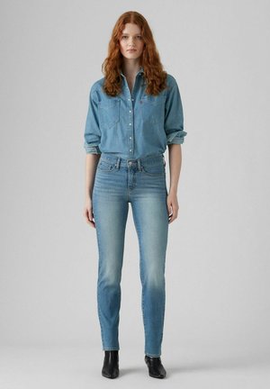- Jeansy Slim Fit