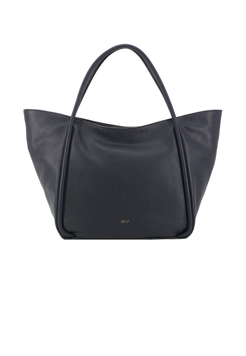 Navy leather tote bag with smooth, textured finish. Features wide, soft handles and a minimalist design. Gold logo on the front.