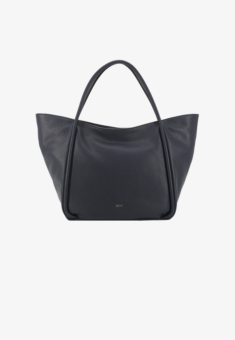 Navy leather tote bag with smooth, textured finish. Features wide, soft handles and a minimalist design. Gold logo on the front.