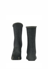 Chaussettes grises avec une finition texturée, dotées d’un bord-côte et d’un talon renforcé. Design simple sans motifs ni branding visible.