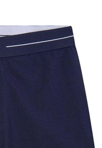 Boxer shorts bleu marine avec une texture douce, une taille élastique avec des coutures blanches, et sans motifs supplémentaires ni détails en matériel.