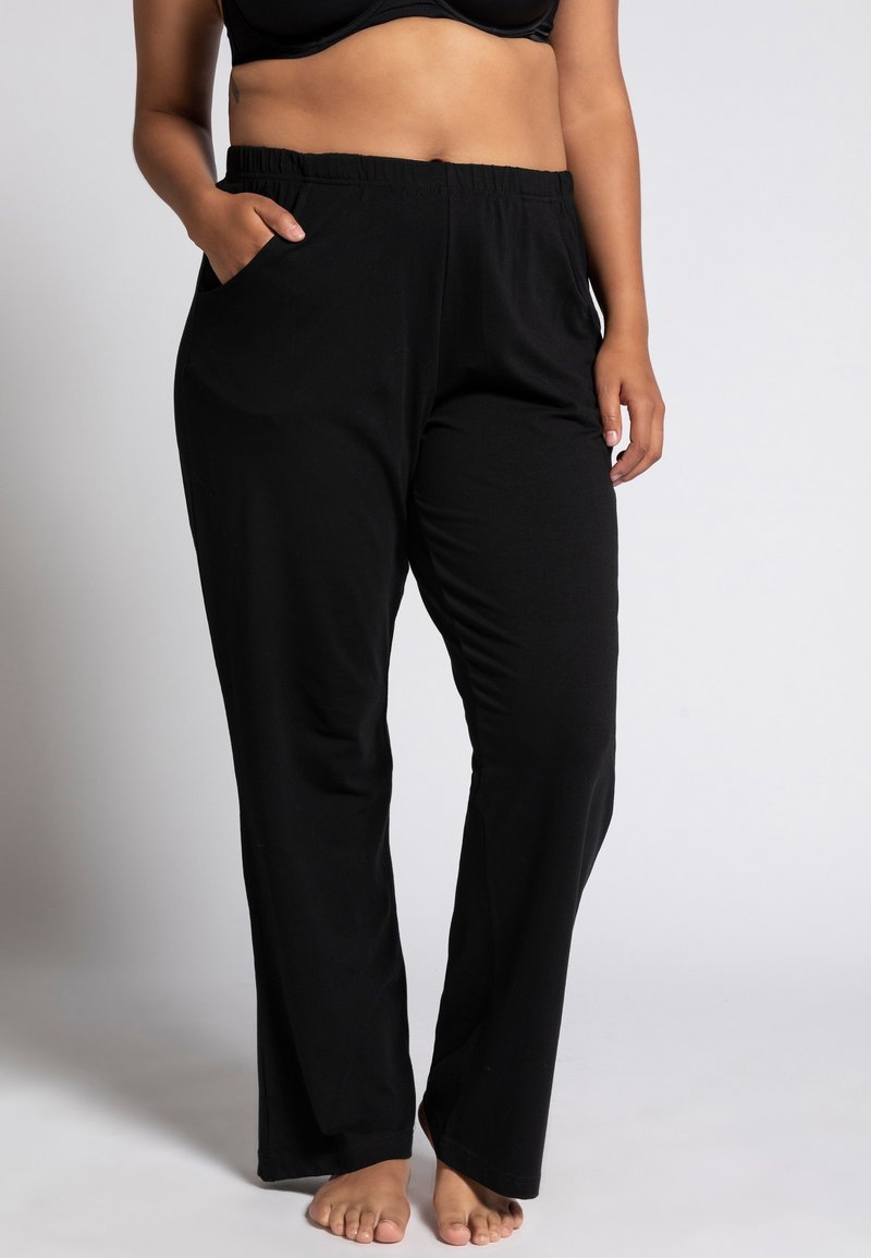 Schwarze, locker sitzende Hose aus weichem Stoff mit elastischem Bund und Seitentaschen. Mit geradem Bein für hohen Komfort.