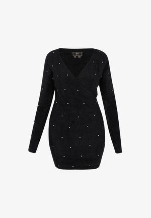 Fekete, hosszú ujjú, átkötős kardigán, puha anyagból készült, fehér gyöngyökkel díszítve, egyenletesen elosztva az elején. V nyakú kivágás.