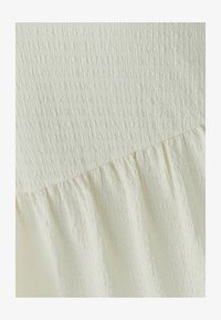 Sélectionné, off white