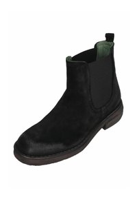 Schwarze Wildleder-Stiefelette mit elastischen Seiteneinsätzen, einem grünen Innenfutter und einer flachen braunen Sohle. Mit einem Zugband für ein einfaches An- und Ausziehen.
