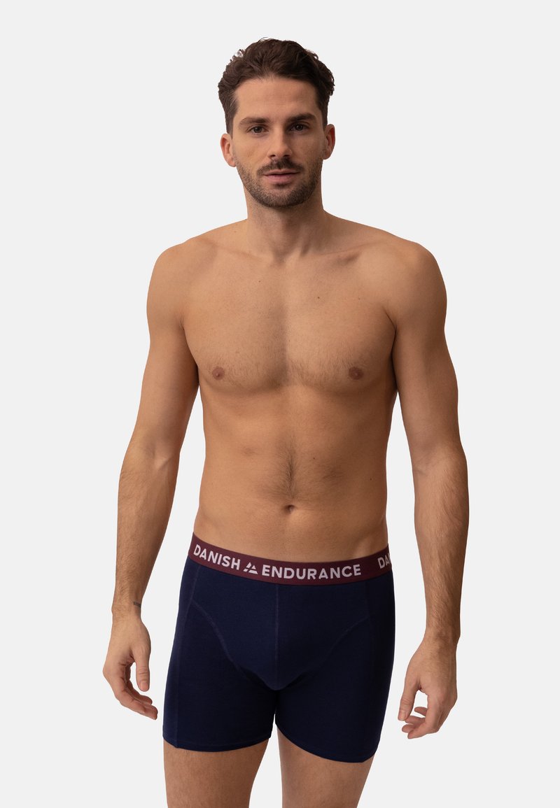 Navy blue boxer briefs featuring a maroon waistband with "DANISH ENDURANCE" printed in white. Made of soft, stretchy material.